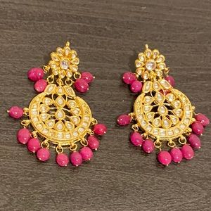 Kundan inspired drop earrings with pink stones.